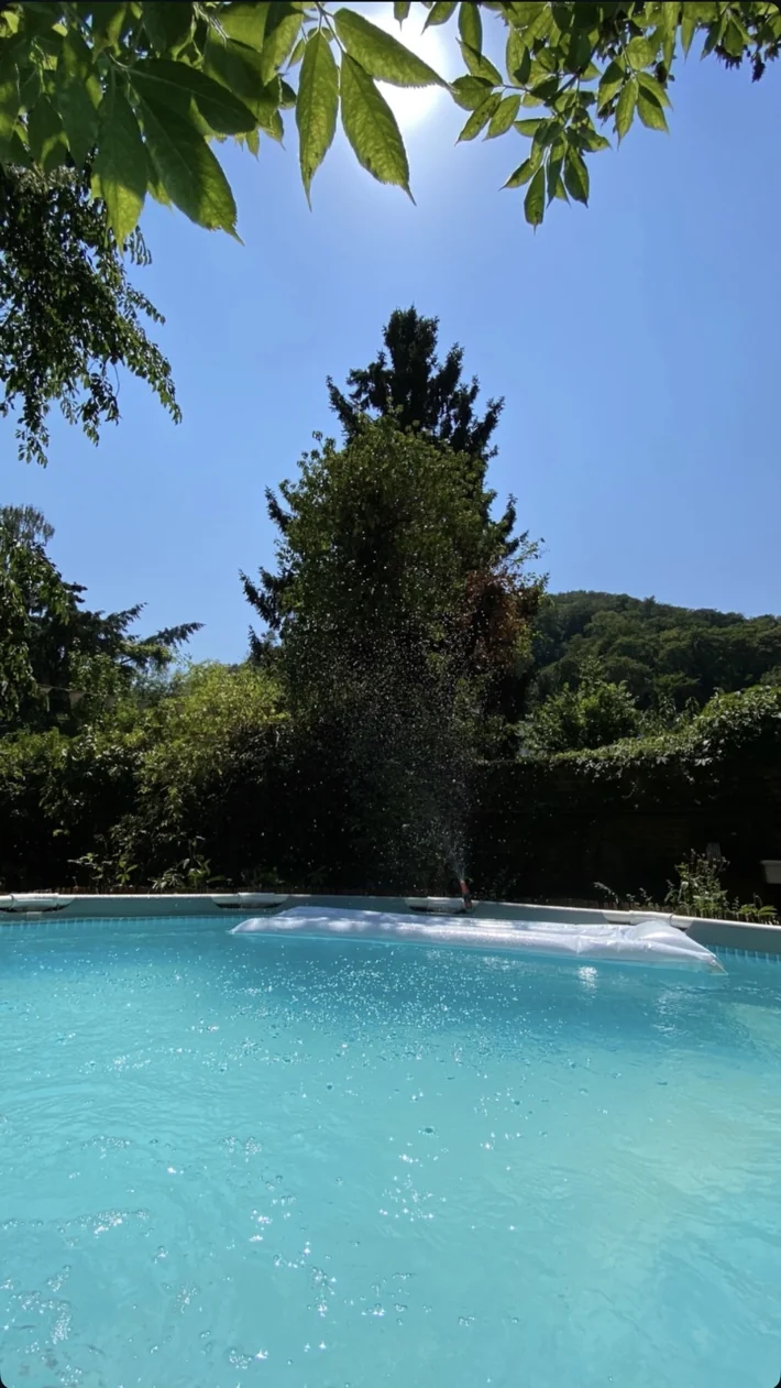 Actual blue pool in Hermanns Garden on a sunny day